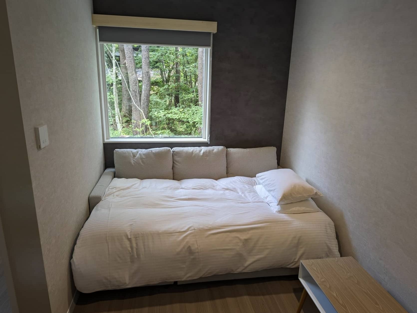 Sofa arranged as an additional bed in Summit Chalets