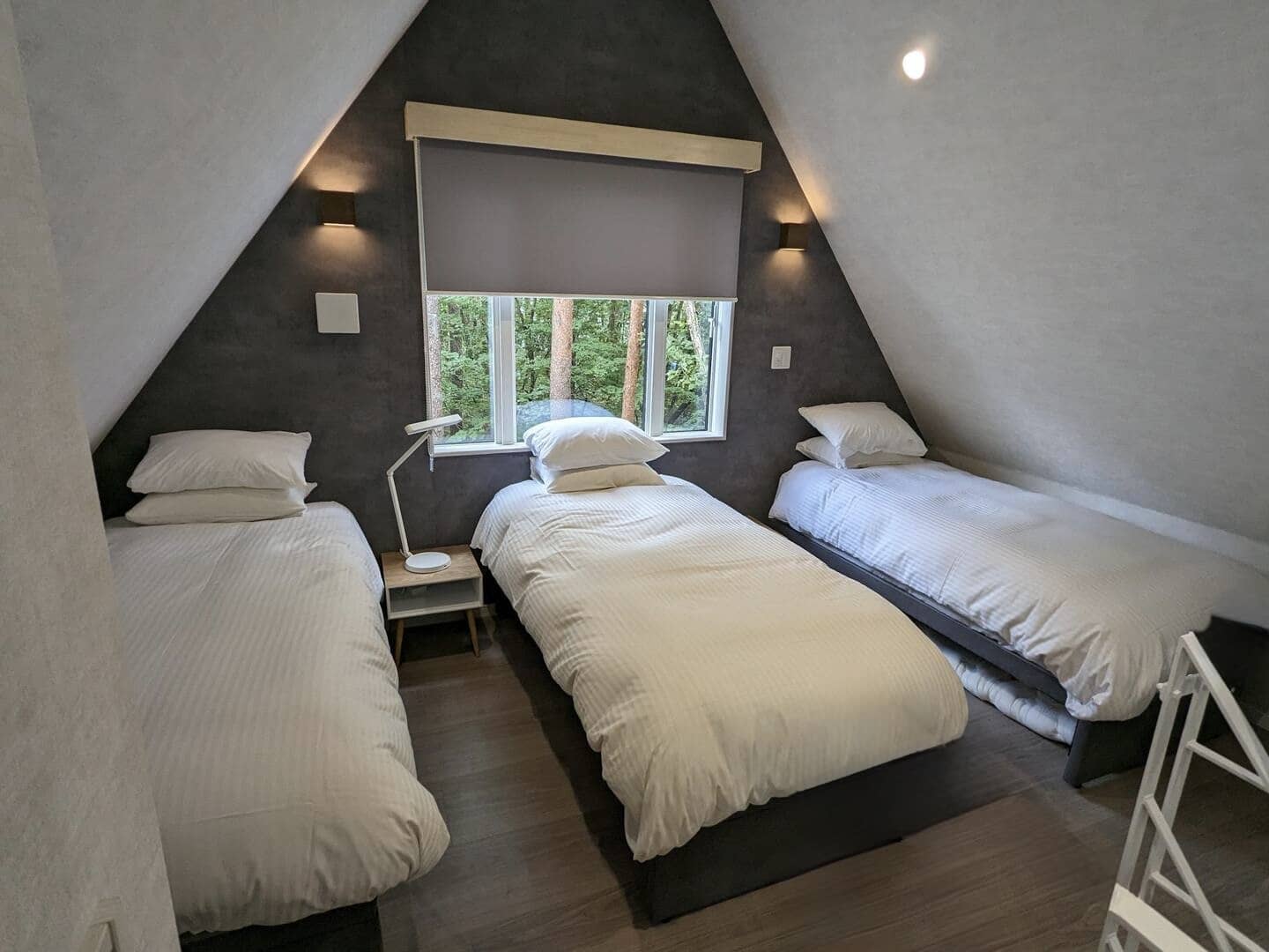 Summit Chalets upstairs bedroom with three single beds